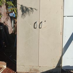 Tall Metal Shelving Cabinet , Has Shelves Inside At Bottom Down For The Moving Of It. 