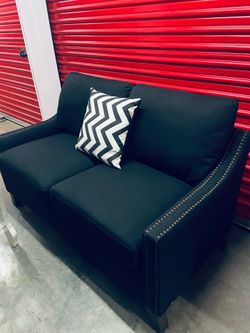 Couch black with brass rivets