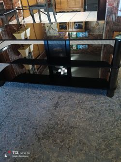 Nice TV stand you can put a 75 in on it I bought two by accident from the Kia store