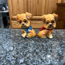 Ceramic Vintage Sad Eye Dog Bow Salt and Pepper Shaker Ceramic.  Size approximately 3 3/4 inches tall.  With original cork stoppers Japan .  Preowned 