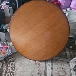 table with 4 chairs and also has glass, table