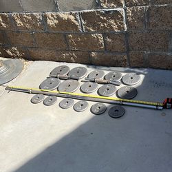 Weights 85 lbs plus solid 5 ft bar and solid 14 inch dumbbell bars