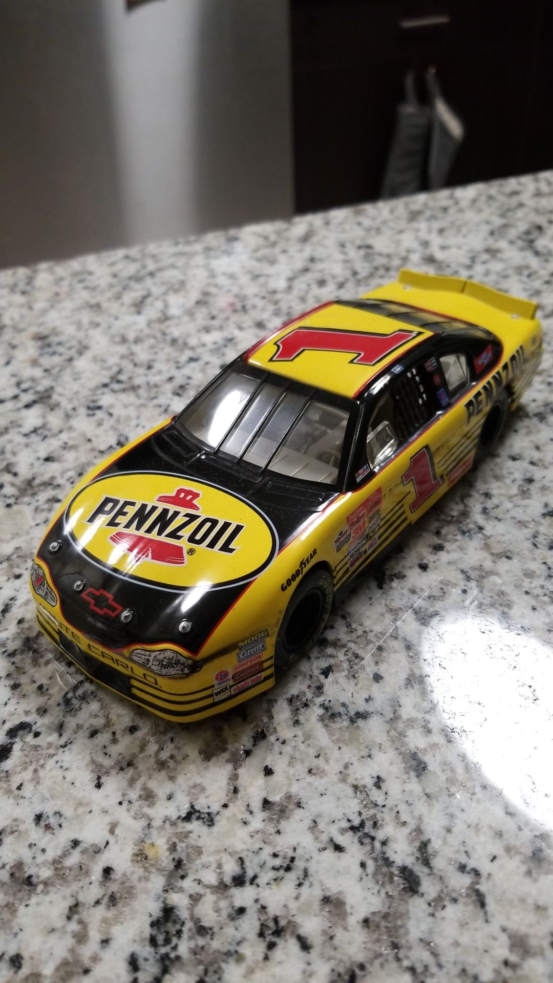 Nascar #1 Pennzoil yellow toy car model.