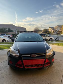 2014 Ford Focus SE with 68,000 miles.