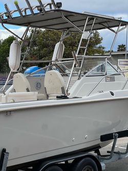 White Fiberglass Fishing Boat with T-Top