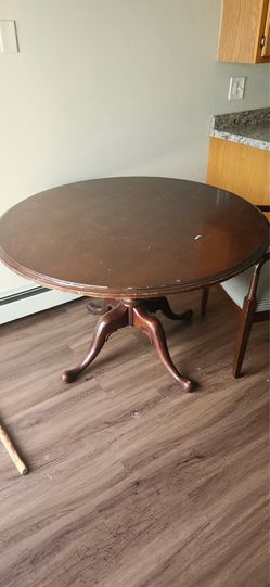 Brown round wooden dinner table