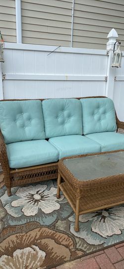 Beautiful complete wicker set sofa with. 2 large wicker chairs and glass wicker table set is a very good set bought from harrows paid $2,500 moving se