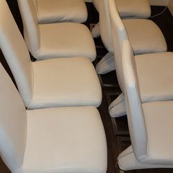 Eight White Faux Leather Dining Chairs