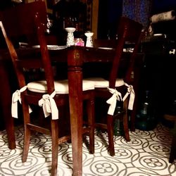 Cherrywood high back table with four chairs and cushions