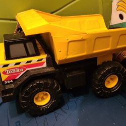 New tag Hasbro Tonka Steel Might Dump Truck 2012 yellow 16 1/2"  #930  item 90691 plastic wheels + under body.  Reg $55 + tax, now $38