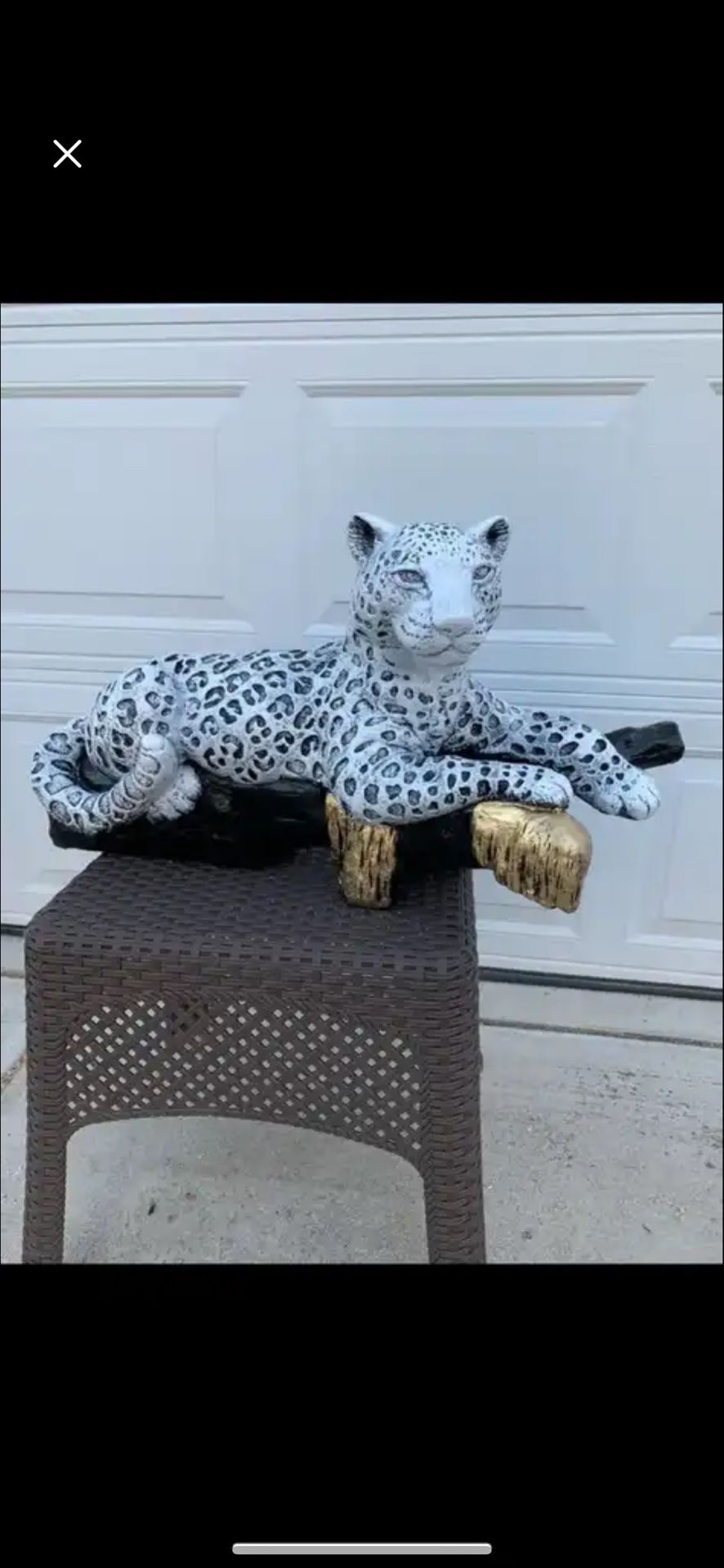 Snow Leopard On The Log Statue