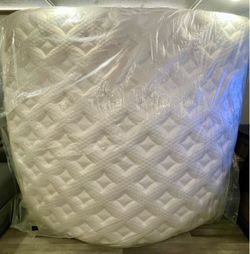 White Quilted Mattress Still in Plastic