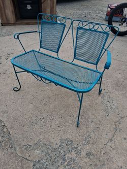 Wrought iron bench read below