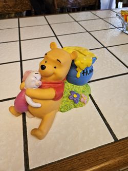 Winnie the Pooh and piglet bank.