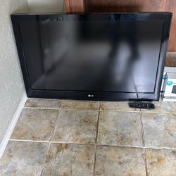2 Flat Screen TVs W/ Covers