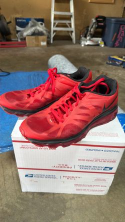 Nike Air Max running shoes in a red and black colorway