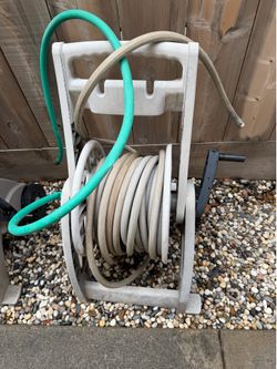 Hose reel cart with garden hose