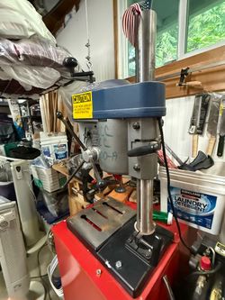 Ryobi drill press on rolling cabinet