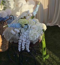 Vintage baby carriage with faux floral arrangement