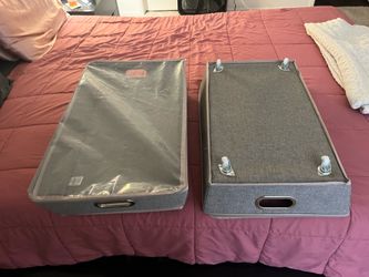 Two rolling storage drawers with zip up cover