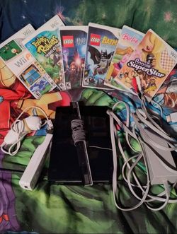 Black Wii console with games, $80 firm