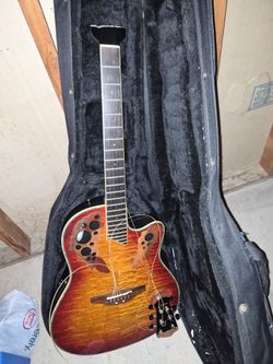 Broken electric acoustic guitar