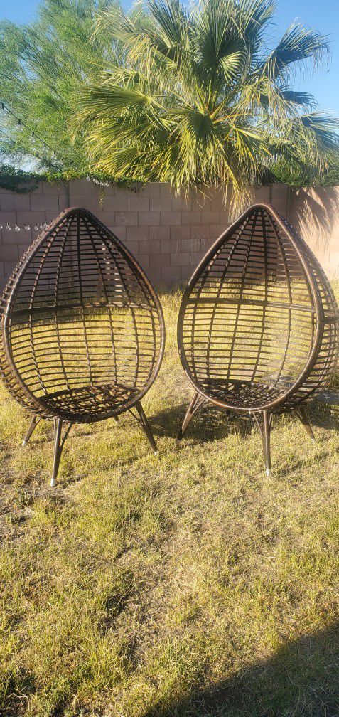 Two Egg Shaped Chairs With Cushions 
