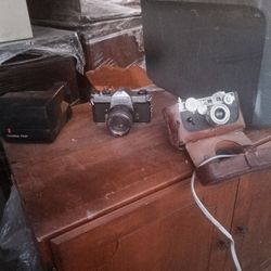 Quantity of three.  Older cameras