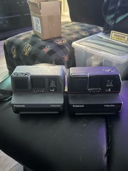 2 vintage Polaroid cameras