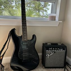 Fender Squier +bag, amp, cord, strings, assorted picks, headphones and the strap