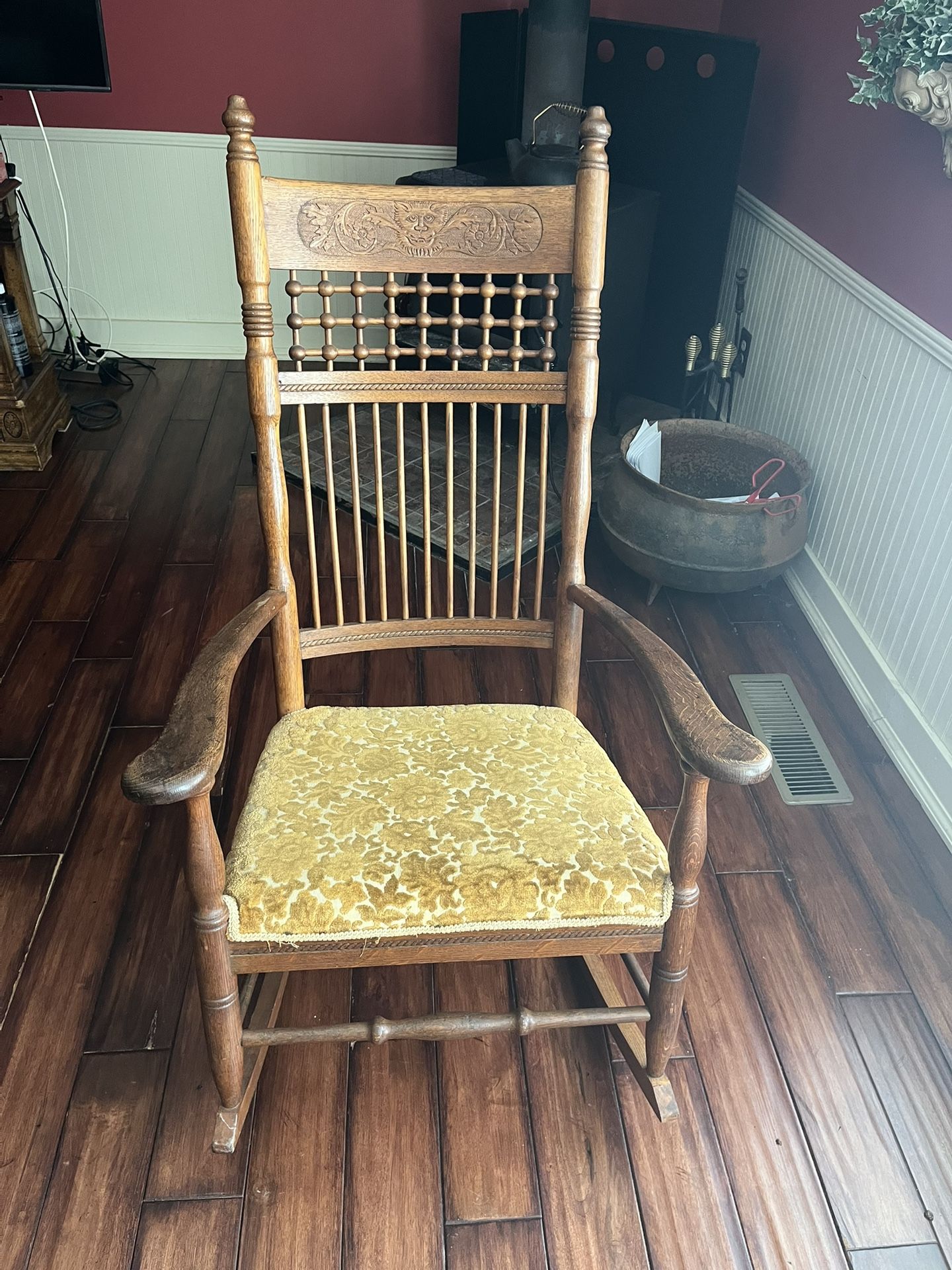 Antique Carved Wood Rocking Chair With Golden Fabric Cushion