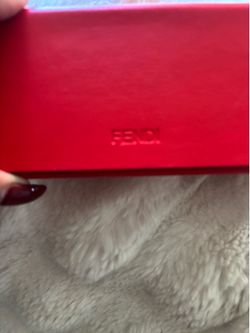 Fendi hard leather sunglasses case featuring embossed lettering