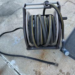 Thick hose with its reel and all its parts