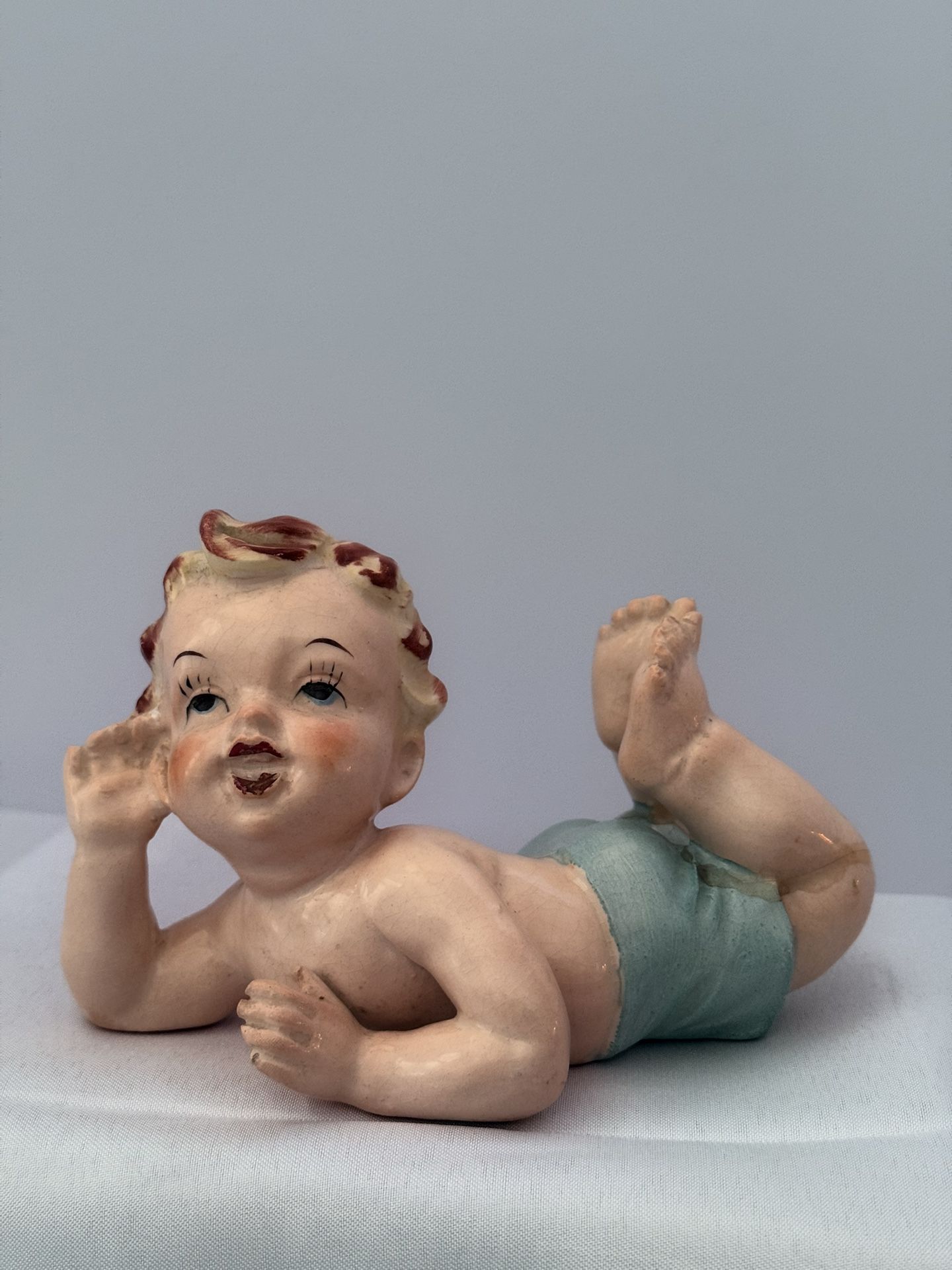 Vintage Bisque porcelain handpainted piano baby (girl). Mid Century.