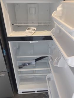 Apartment size stainless steel refrigerator