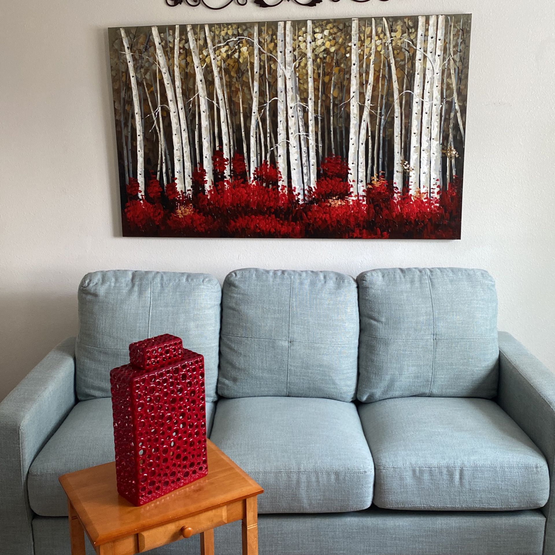 Sofa, Wall Art, and Side Table With Drawer 