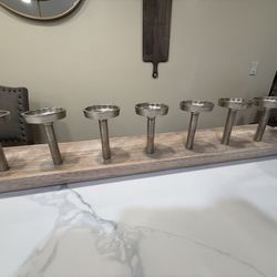 7-branch wooden candle stand, often used as a table centerpiece. 