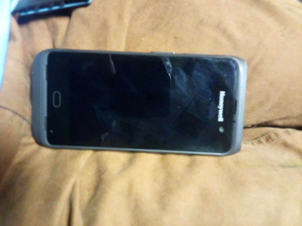 Honeywell code scanner , code adjuster, and unlocked smartphone.