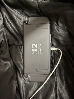 Nintendo switch two with purple and green joycons