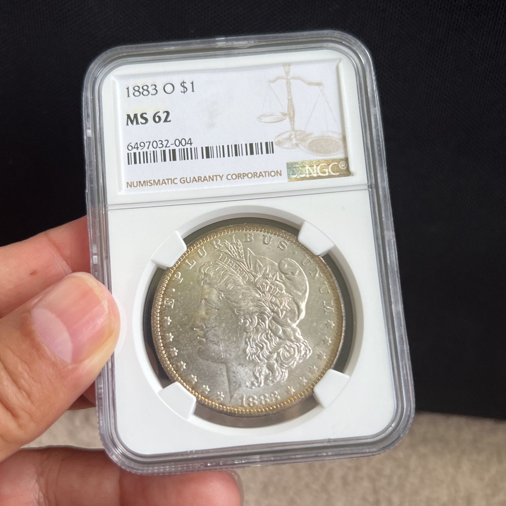 1883-O Morgan Dollar. Graded NGC MS 62.  Authentication Done For You