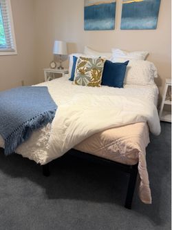 Black metal bed frame and memory foam mattress