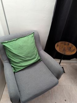 Upholstered armchair and side table