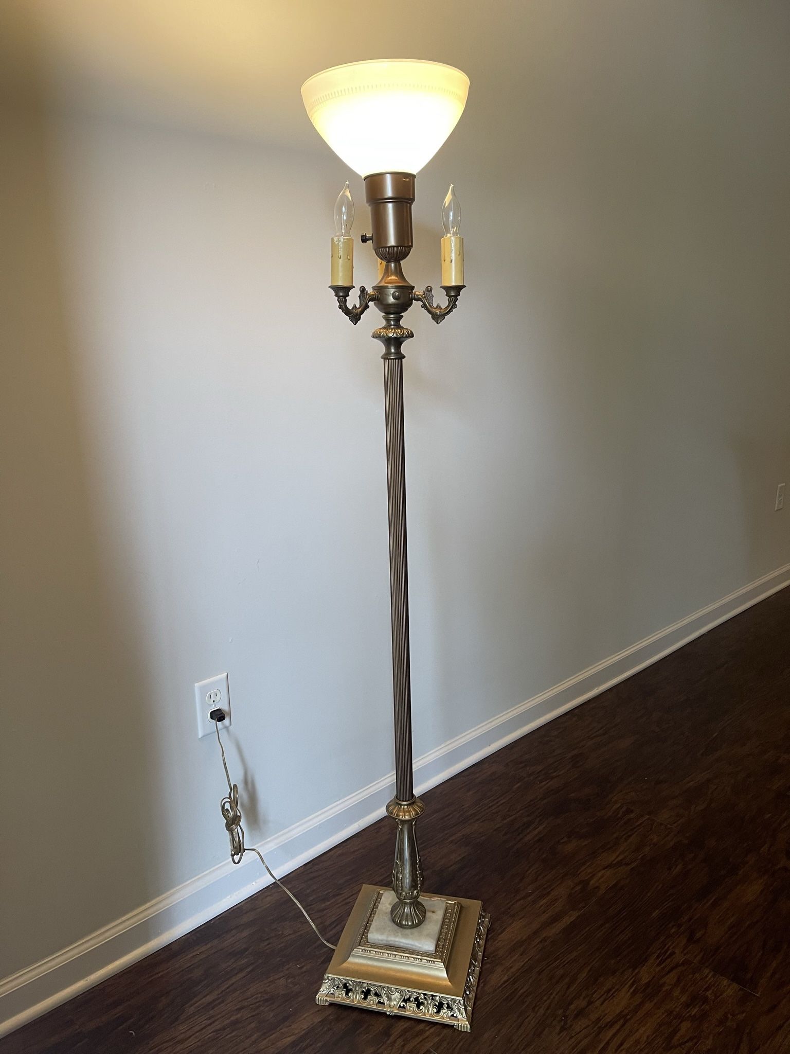 Antique Floor Lamp with Milk Glass globe and 3 candelabra lights and marble in base. 