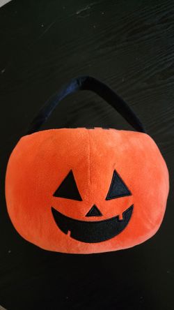 Plush orange jack-o'-lantern halloween basket