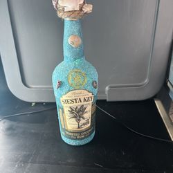 Decorated and lighted empty liquor bottles