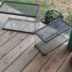 10 gallon aquarium with an oversize screen lid and smaller tank