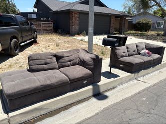 Free sectional with feet at curb