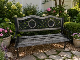 Rustic Wooden Slat Garden Bench with Wrought Iron Ornate Ends! Not very Sturdy. One of the slats has a split. Great for decor! 50x25x32in Seat Height 