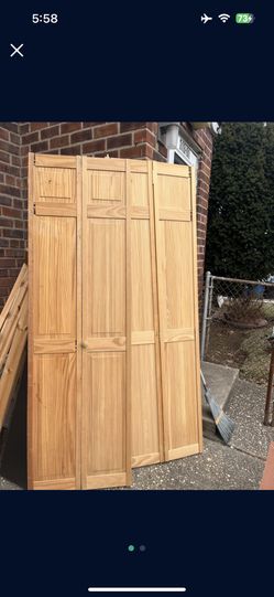 Solid.  Wood.   Closet Doors.  ( New. ).    48x24