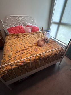 Vintage feminine ornate IKEA white cast iron queen bedframe